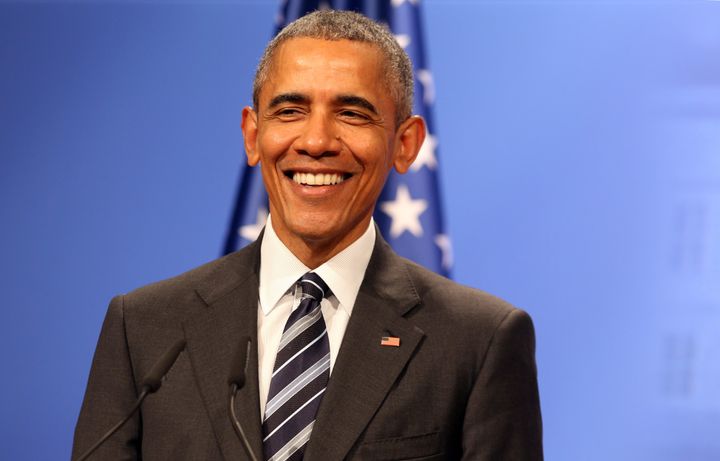 President Barack Obama smiling, presumably about Republican tax proposals.