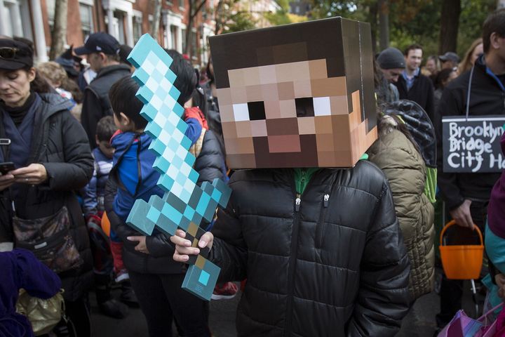 A child dressed as a character from Minecraft takes part in a Halloween parade in New York City. Kids -- and adults -- can now step inside the game in virtual reality.