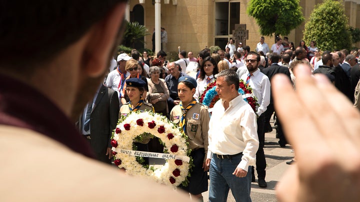 Armenian Youth Scouts lay a wreath in front of the Catholicosate of Cicilia Church in Antelias to commemorate those killed in the Armenian Genocide.