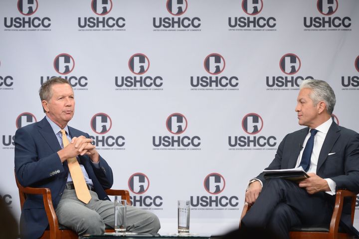 Republican presidential candidate and Ohio Gov. John Kasich, left, speaks with U.S. Hispanic Chamber of Commerce President and CEO Javier Palomarez at an event in October.