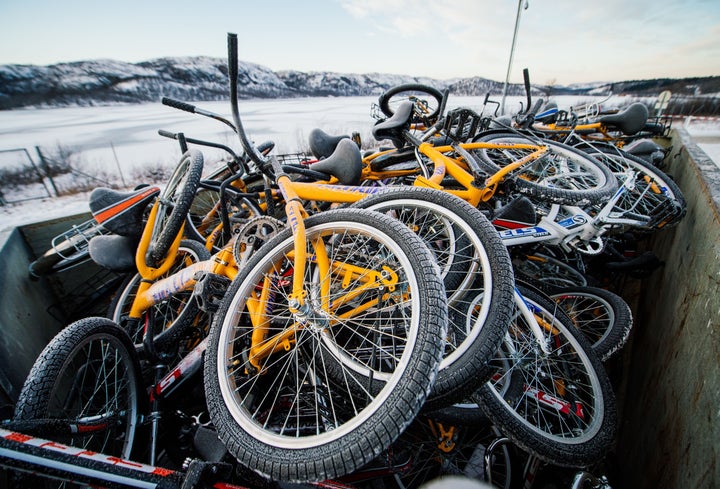 Refugees, mainly Syrian, cross the border from Russia into Norway on bikes.