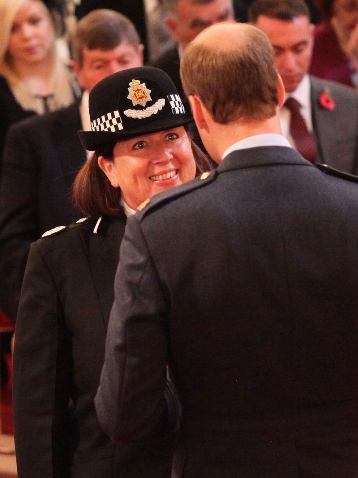Dawn Copley is decorated with the Queen's Police Medal by Prince William at Buckingham Palace in 2015.