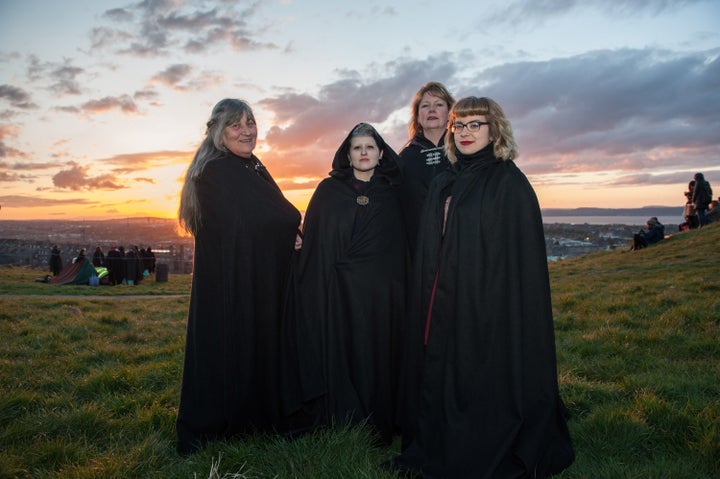 Members of the public wait to watch performers celebrate the coming of summer by during the Beltane Fire Festival on Calton H