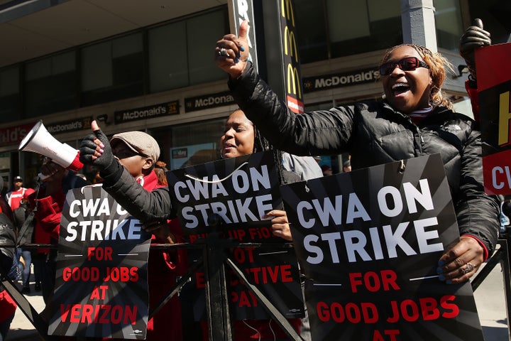 Hundreds of Verizon workers strike outside of the telecommunications company's Brooklyn offices on April 13 in New York City.