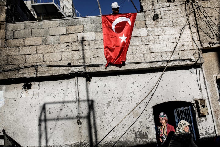 Turkey's border area with Syria is home to a large Syrian refugee population. Above, a damaged house in the border