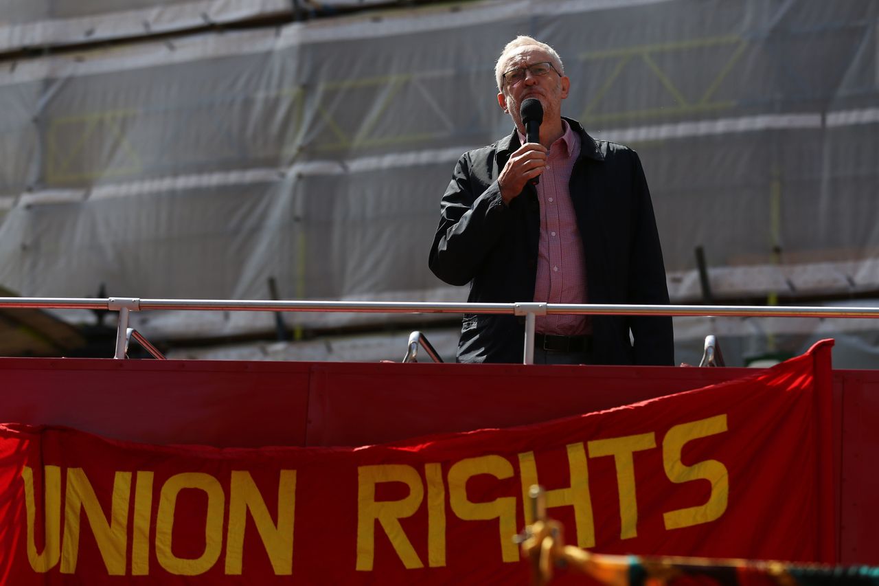 Labour Party leader Jeremy Corbyn gives a speech from the top of a double-decker bus at a May Day rally in London