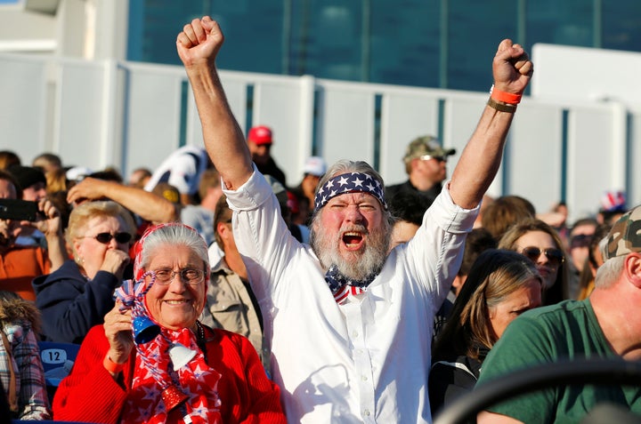 Supporters of Republican U.S. presidential candidate Donald Trump cheer at a campaign rally in Costa Mesa, California April 2