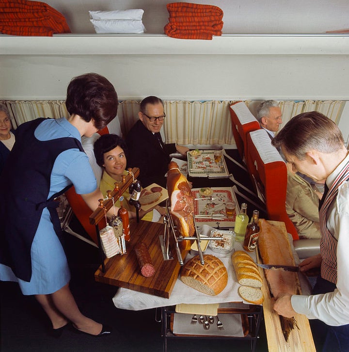 An "air hostess" serves what the airline calls its "Scandinavian country-style buffet," 1968.