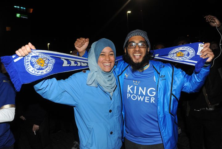 Leicester City fans celebrating winning the league outside King Power Stadium