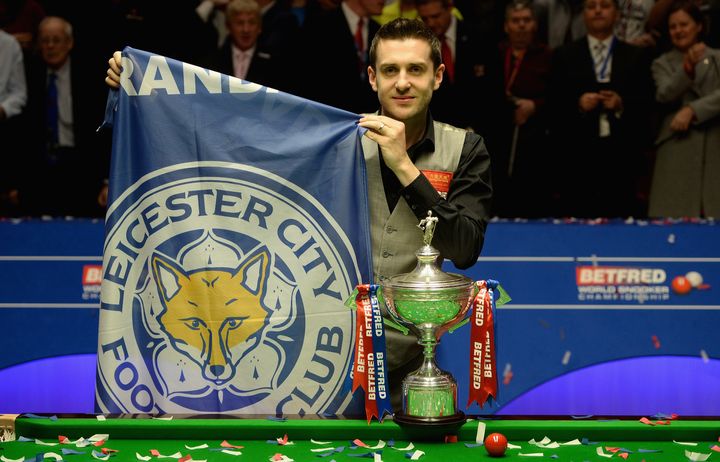 Mark Selby with a Leicester City football club flag after lifting the trophy