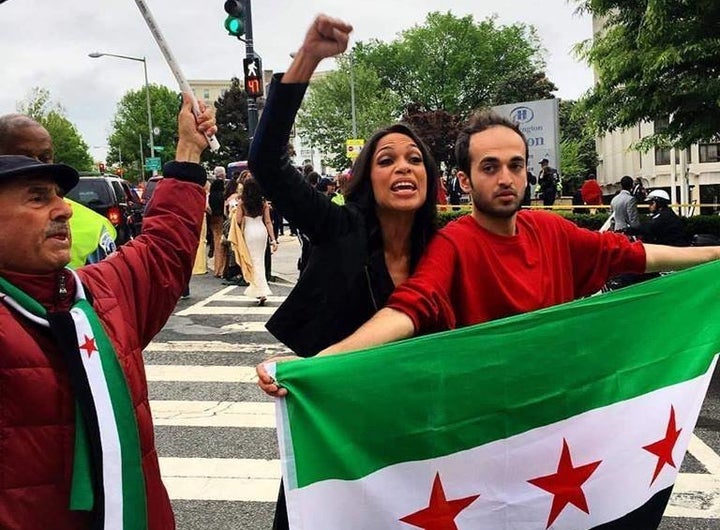 Actress Rosario Dawson demonstrates next to a man in Washington, D.C. Some demonstrators demanded that government blocka