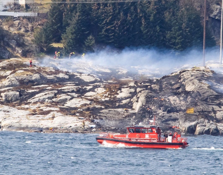 <strong>Rescuers at the crash site on April 29</strong>