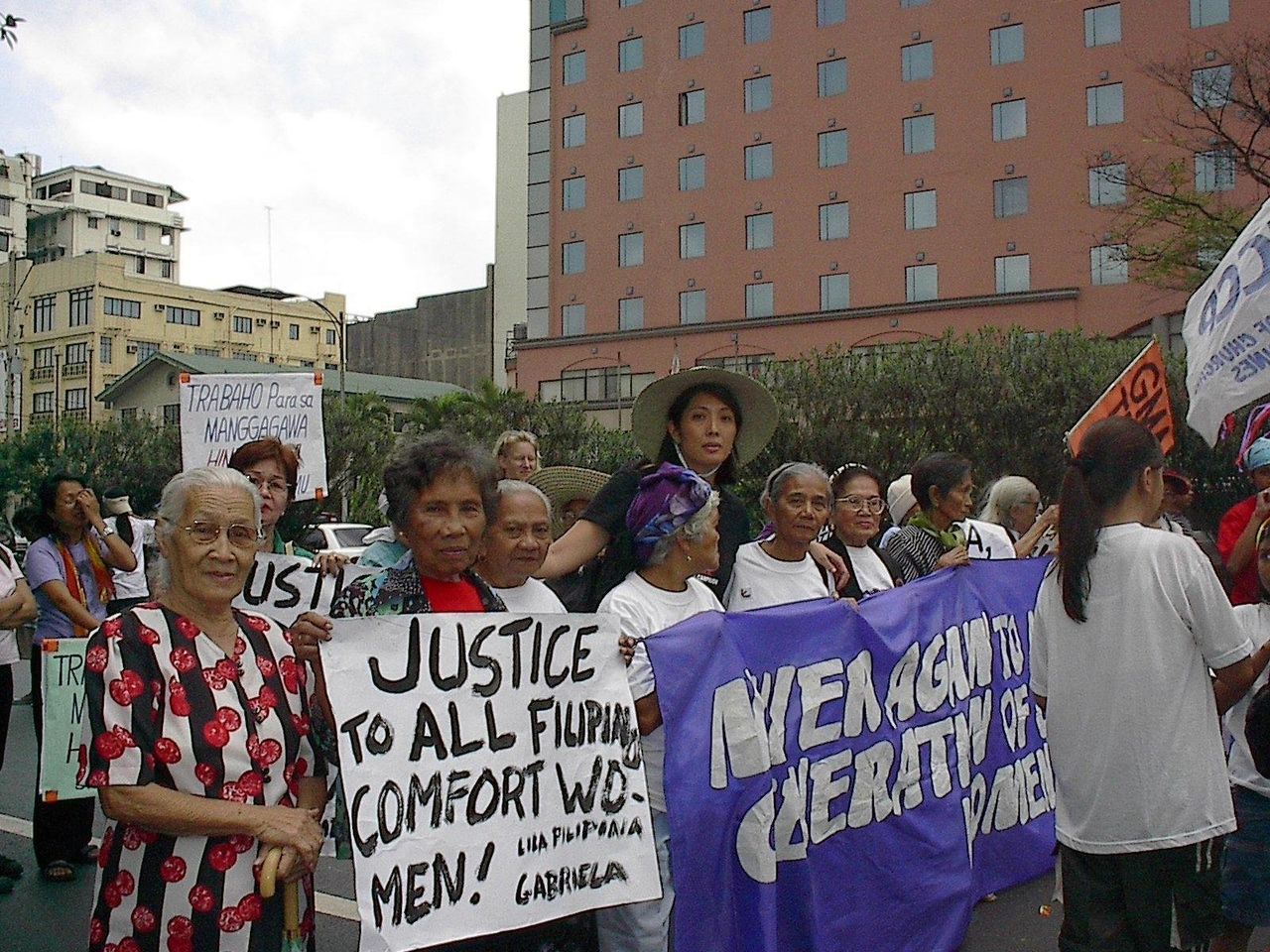 M. Evelina Galang marches with the Lolas at an International Women's Day protest in 2002.