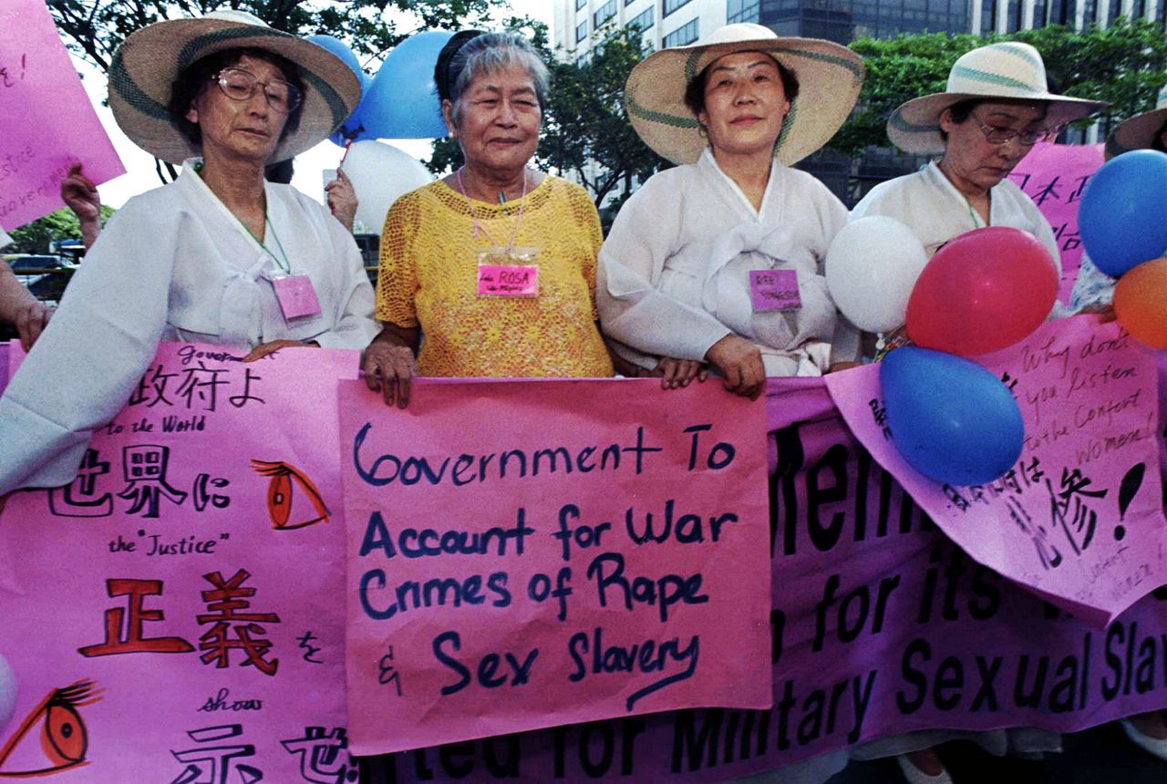 Rosa Maria Henson (second from left), from the Philippines, joins Korean "comfort women" Kim Soon Duk (left) and Yoong Sue Ree (second from right) during a protest rally staged in front of the Japanese embassy in Manila in 1996. Henson died a year later.