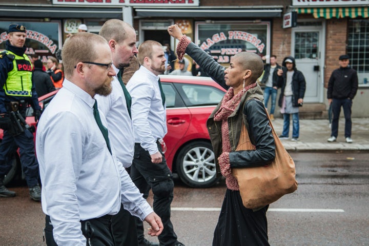 Tess Asplund opposite the uniformed Nazi demonstrators in Borlange, Sweden