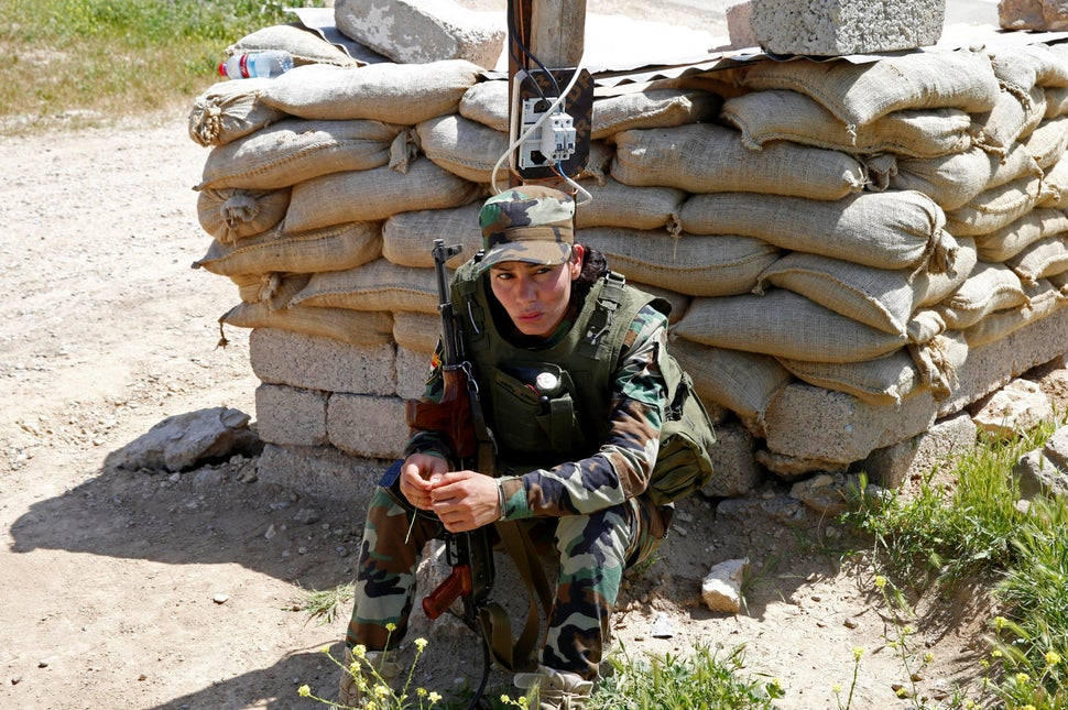 Asema Dahir, 21, says she is stunned by the brutality of the militants. Here, she keeps guard during a deployment n