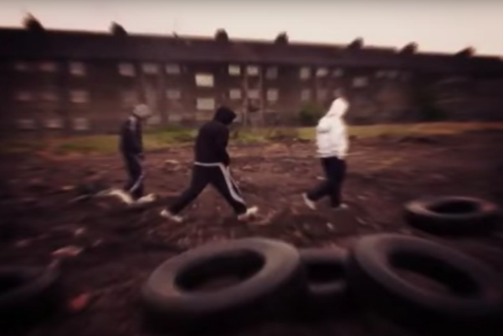 Hooded youths are seen besides dumped car tyres in one of the grim snaps