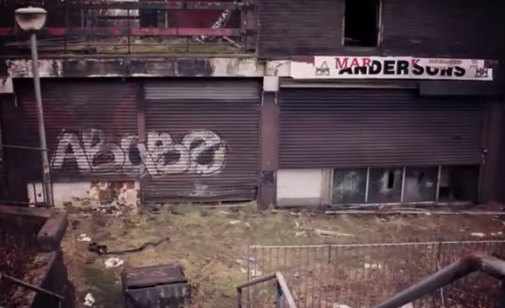 Graffiti-strewn shutters and overgrown paving feature in the film