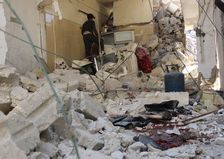 DAMASCUS, SYRIA - MARCH 31: Debris of a building are seen after air strikes by Asad regime forces targeting a school and an hospital in Deir al Asafir town of Eastern Ghouta in Damascus, Syria on March 31, 2016. (Photo by Muhammed Khair /Anadolu Agency/Getty Images)