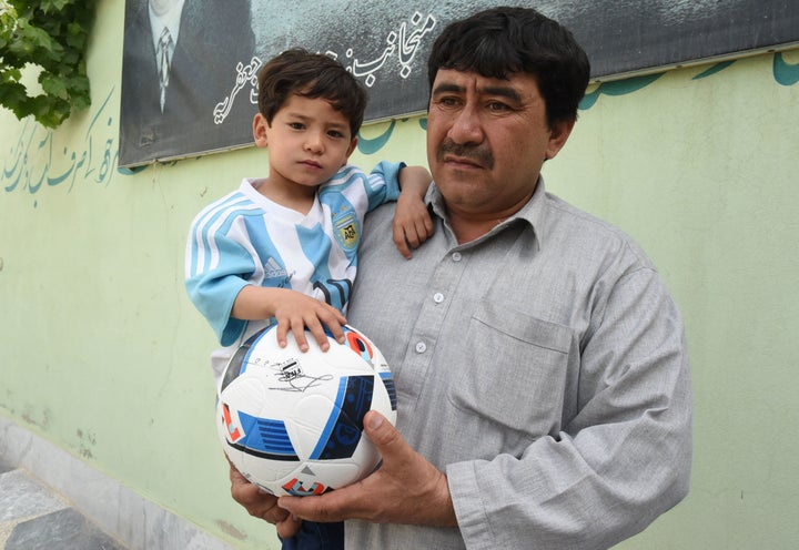 Murtaza and his father in their new home in Pakistan