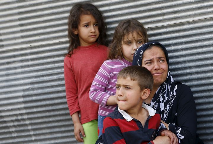 Syrian children with their mother in the Turkish town of Kilis near the Syrian border on April 24, 2016