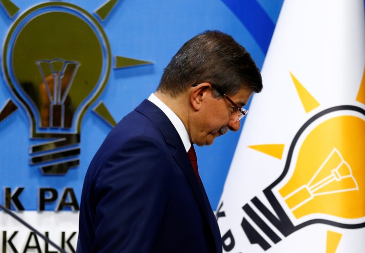 Turkish Prime Minister Ahmet Davutoglu leaves a news conference at AK Party headquarters in Ankara, Turkey, after announcing