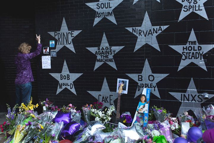 A fan mourns the loss of Prince outside First Avenue—a club he made famous through his movie Purple Rain—just hours after announcement of his death.