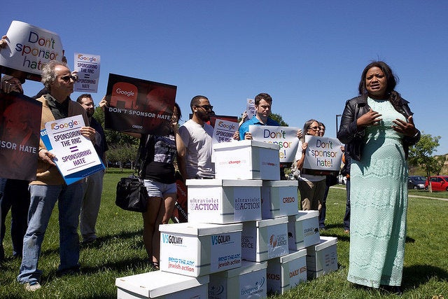 Activists protest at Google's headquarters on April 28. Progressive groups are stepping up pressure on Google to ca