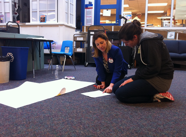 Alicia Nicas (right), a Seattle Teacher Residency graduate student, prepares a lesson with the help of a University of Washington literacy instructor.