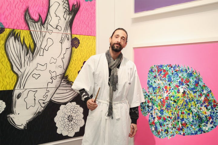 Artist Adrien Brody displays his work during the the kick off of Art New York and CONTEXT for 2016 New York Art Week at Pier 94 on May 3, 2016 in New York City.