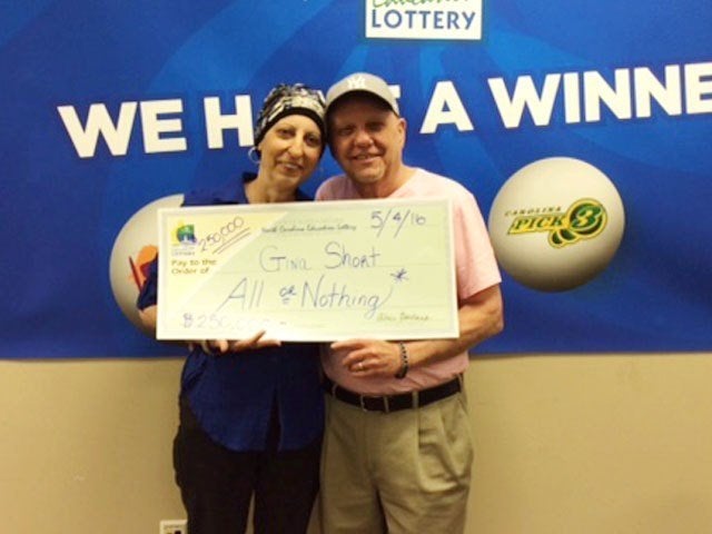 Gina Short, with her husband Len, beat the 1 in 2.7 million odds of winning the $250,000 prize.