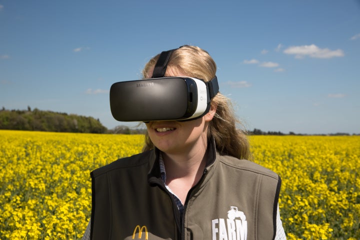 Young farmer Alice Partridge tries a virtual reality headset as part of a new initiative to reveal the secrets behind McDonald's food