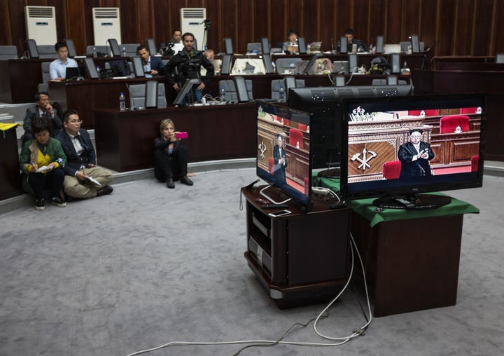 Foreign journalists invited to cover the event were not permitted inside the congress. Here, journalists watch a television broadcasting Kim Jong Un's speech in a hotel in Pyongyang.