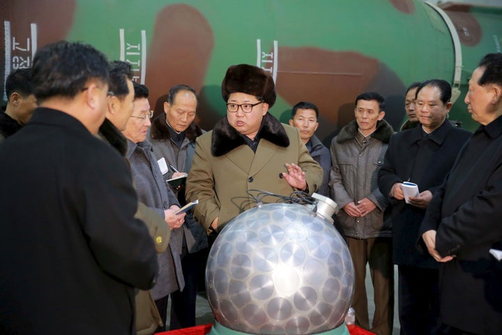 North Korea has grown increasingly isolated over its pursuit of a nuclear program, which led to the UN's tightening sanctions against the country. Kim meets with nuclear scientists and technicians in this undated photo.