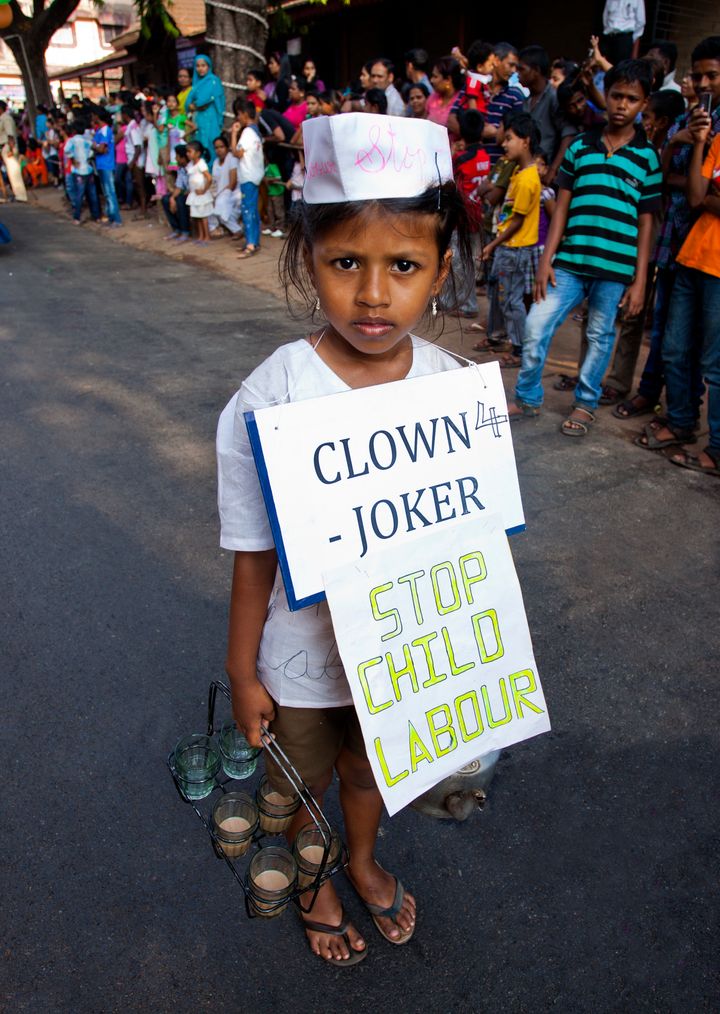 Girl protesting against child labor during a procession in a carnival, Goa Carnivals, Goa, India. (Photo by: Exotica.im/UIG via Getty Images)