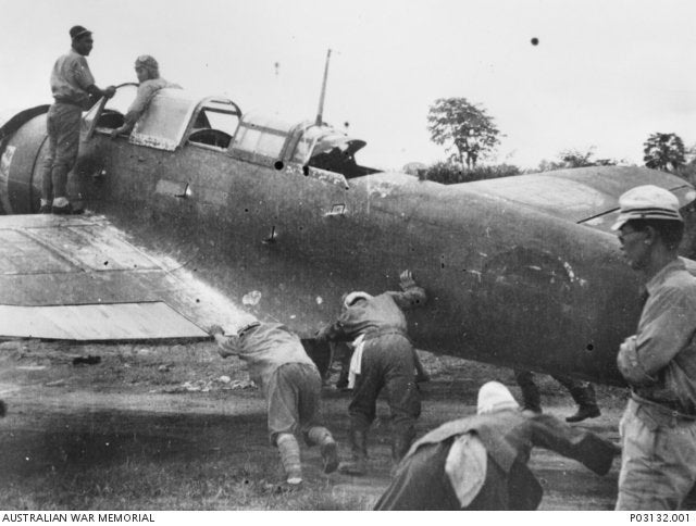 A Nakajima B5N2 'Kate' bomber of the Imperial Japanese Navy. This aircraft, coded '302,' was the last flyable bomber left at Rabaul by the end of WWII. The aircraft was operated by the 105th Naval Base Air Unit. Escorted by four RNZAF Vought F4U-1 Corsair fighters, it was flown to Jacquinot Bay on October 14,1945 by Warrant Officer Kataoka Goro and surrendered. The photograph depicts Japanese ground crew probably at Rabaul preparing the aircraft for its last flight.