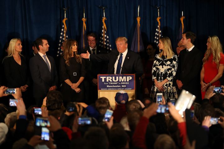 Donald McGahn II, center, stands with Donald Trump on the stage during an election night party Feb. 9, 2016 in Manchester, New Hampshire. (Photo by Joe Raedle/Getty Images)