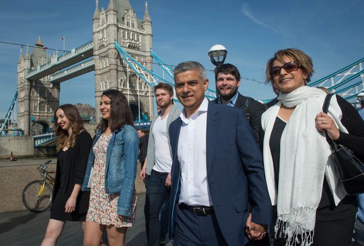 Labour mayoral candidate Sadiq Khan arrives at City Hall in London with his wife Saadiya (right)