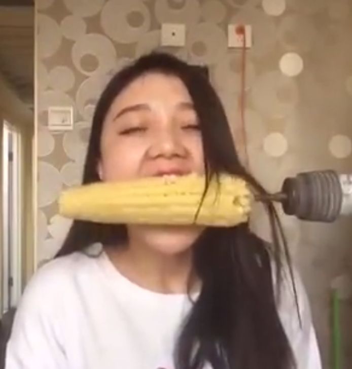 Woman has hair ripped out after trying to eat corn on the cob off spinning drill