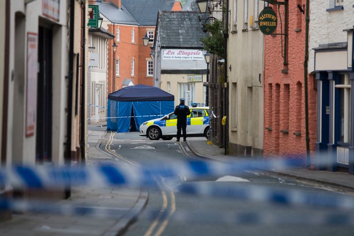 <strong>The man was found unconscious and injured in Brecon town centre</strong>