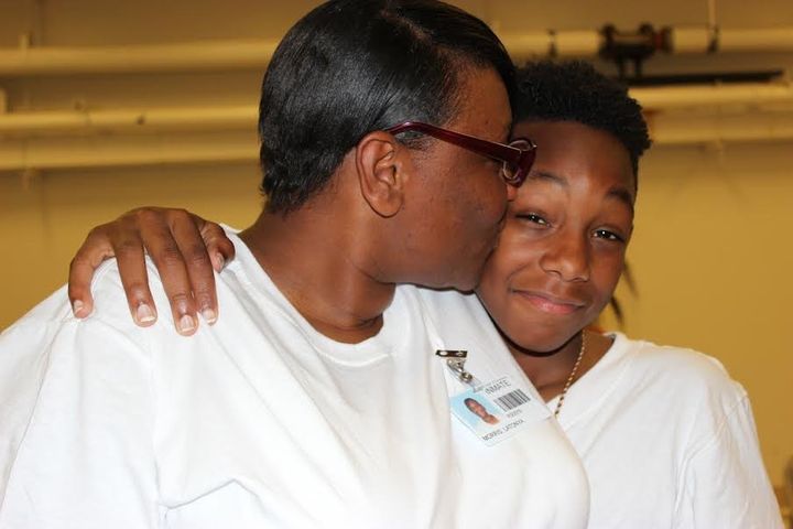 Malik, 13, hugs his mother, Latonya, for the first time in months during a visit to the Decatur Correctional Facility in Decatur, Illinois.