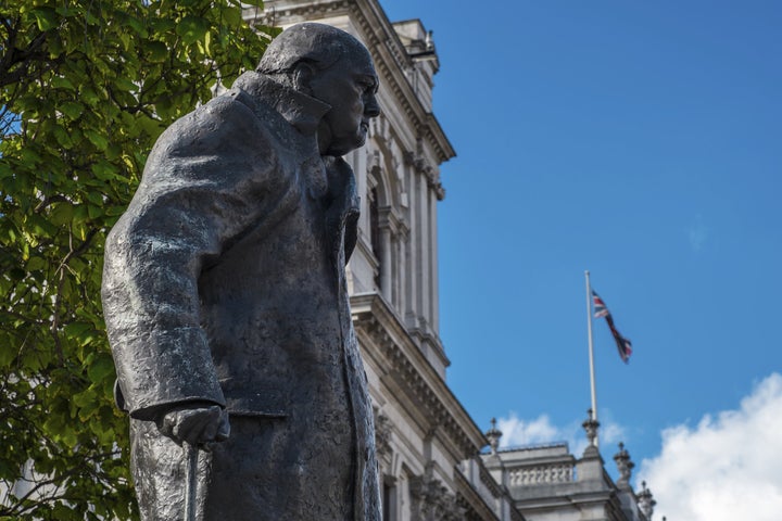 A statue of Sir Winston Churchill looks out over Parliament Square