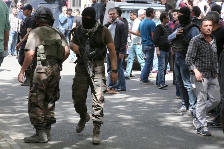 Members of the Turkish police special forces secure a street. Nine members of the separatist Kurdistan Workers Party and one