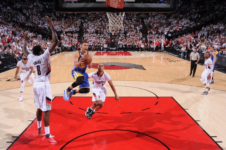 Stephen Curry drives to the rim against the Portland Trail Blazers in Game Four of the Western Conference Semifinal