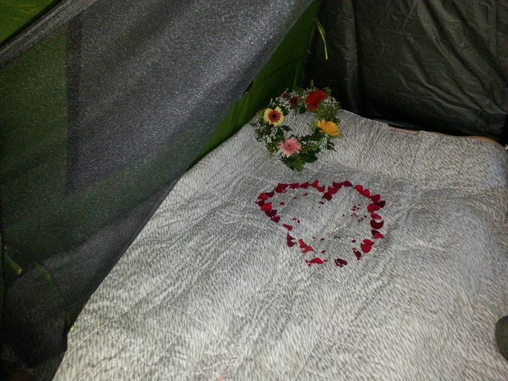 Volunteers decorated the couple's bed with flower petals and a recycled flower wreath.