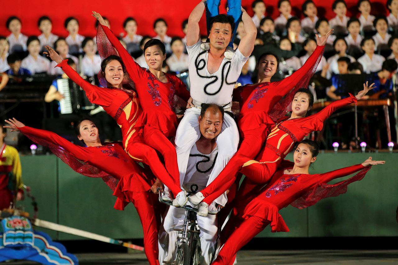 Acrobats perform in the ceremony.