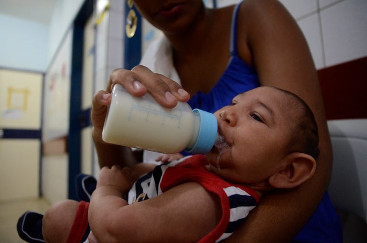 RECIFE, BRAZIL - FEBRUARY 01: João Heitor baby born with microcephaly is held by his mother Gabrielly Santana da Paz a
