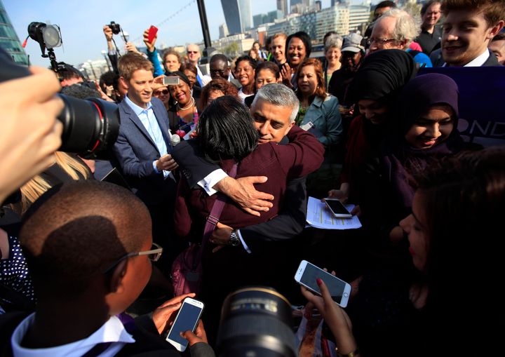 Sadiq Khan mobbed by well-wishers on his first day in office