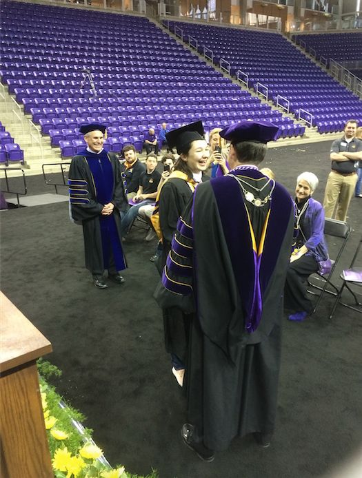 Johnston receives her diploma.