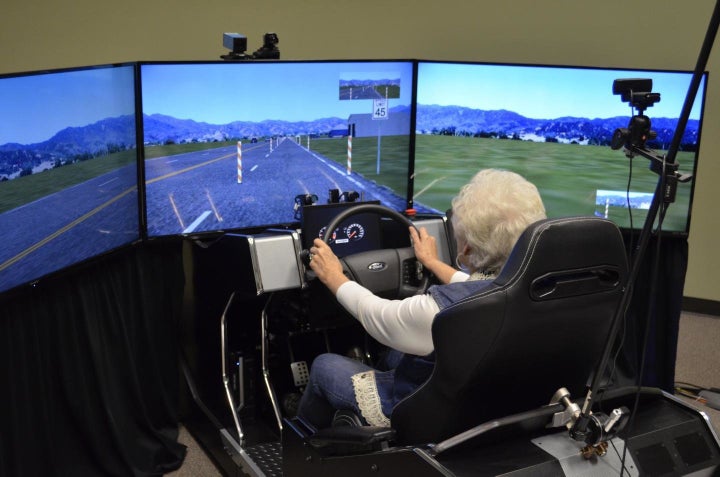 One of the 59 volunteers in a distracted driving study by the University of Houston and Texas A&M Transportation Institute sits in a high-fidelity driving simulator.